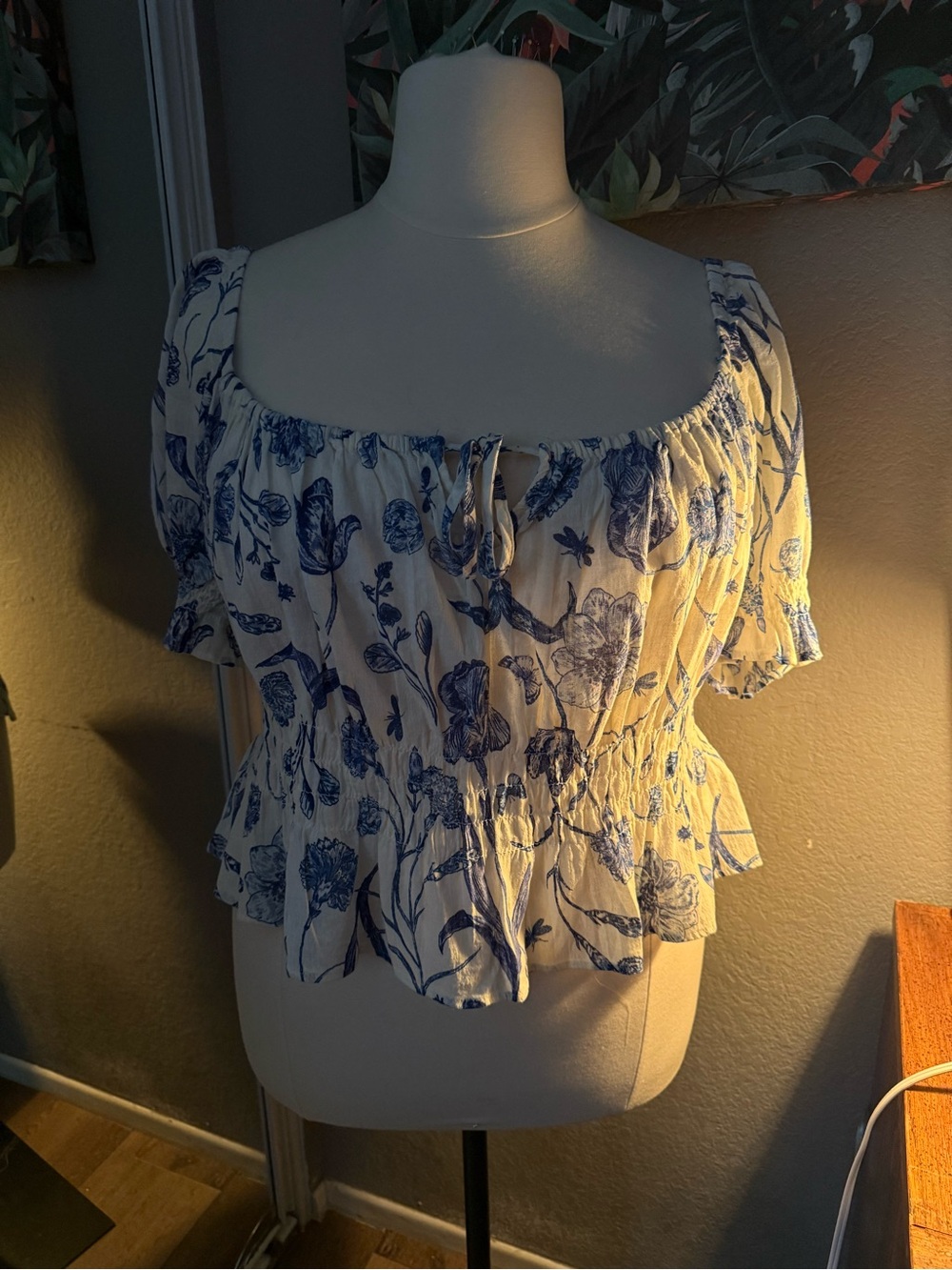 100% cotton 
H&M White Crop Top with Blue Floral Print